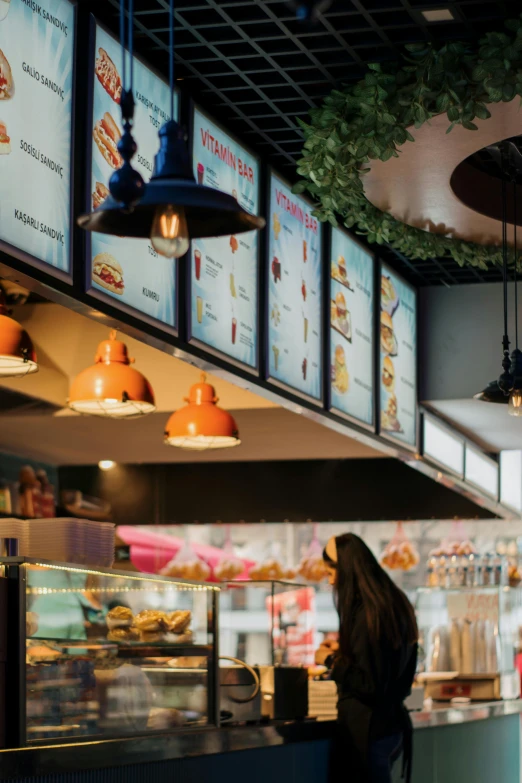 a woman is ordering food in the restaurant