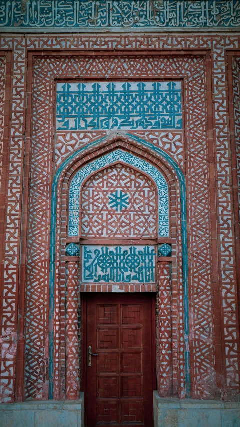 red door with an intricate geometric design is displayed