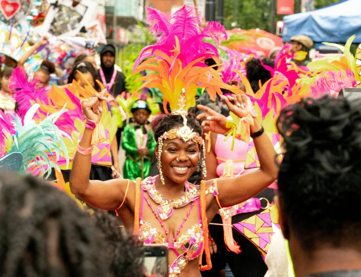 woman in an elaborate dress and feathered headgear at a carnival