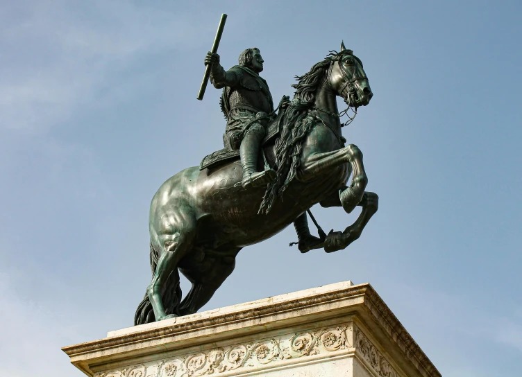 a statue on a horse, with a soldier on it