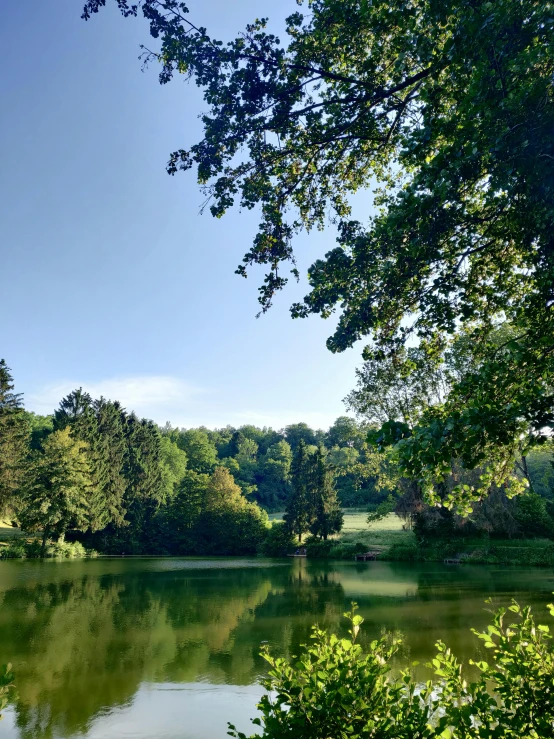 a lake surrounded by trees and water with no boats on it