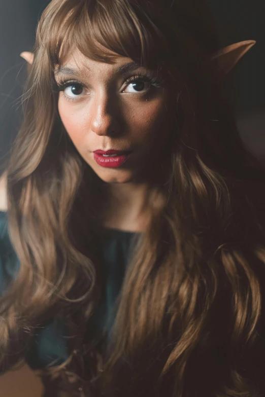 a very pretty lady with long brown hair