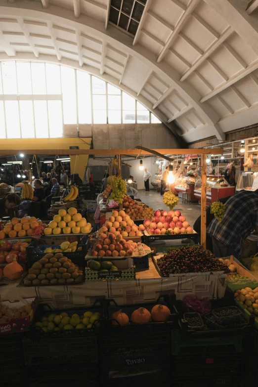 a market has fresh fruits, fruit and people