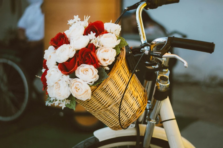 a bicycle with a basket full of flowers