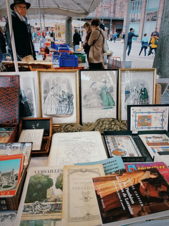 a table with old fashion books and pamphlets