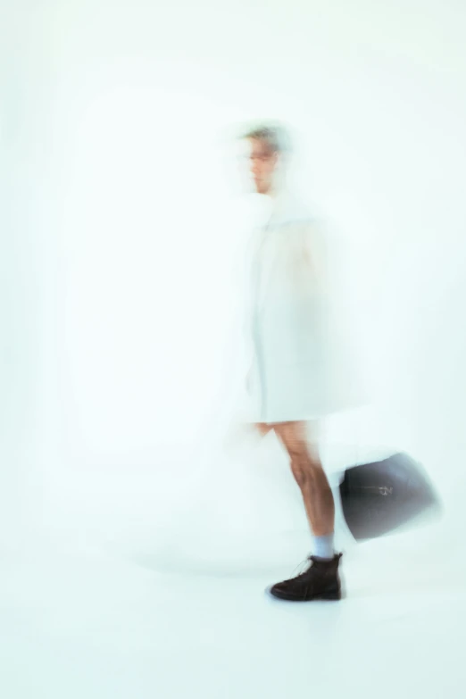 a man in white coat carrying a briefcase