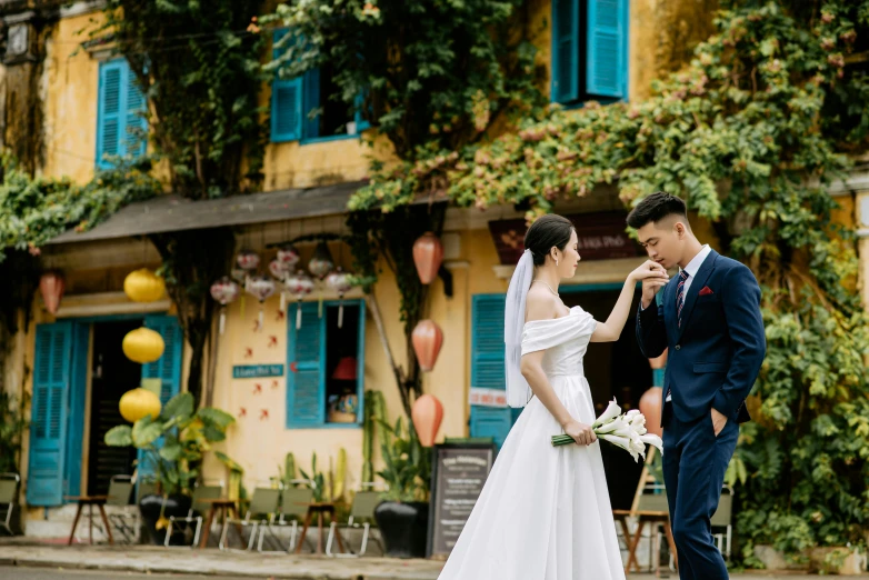 two people in formal clothes standing next to each other