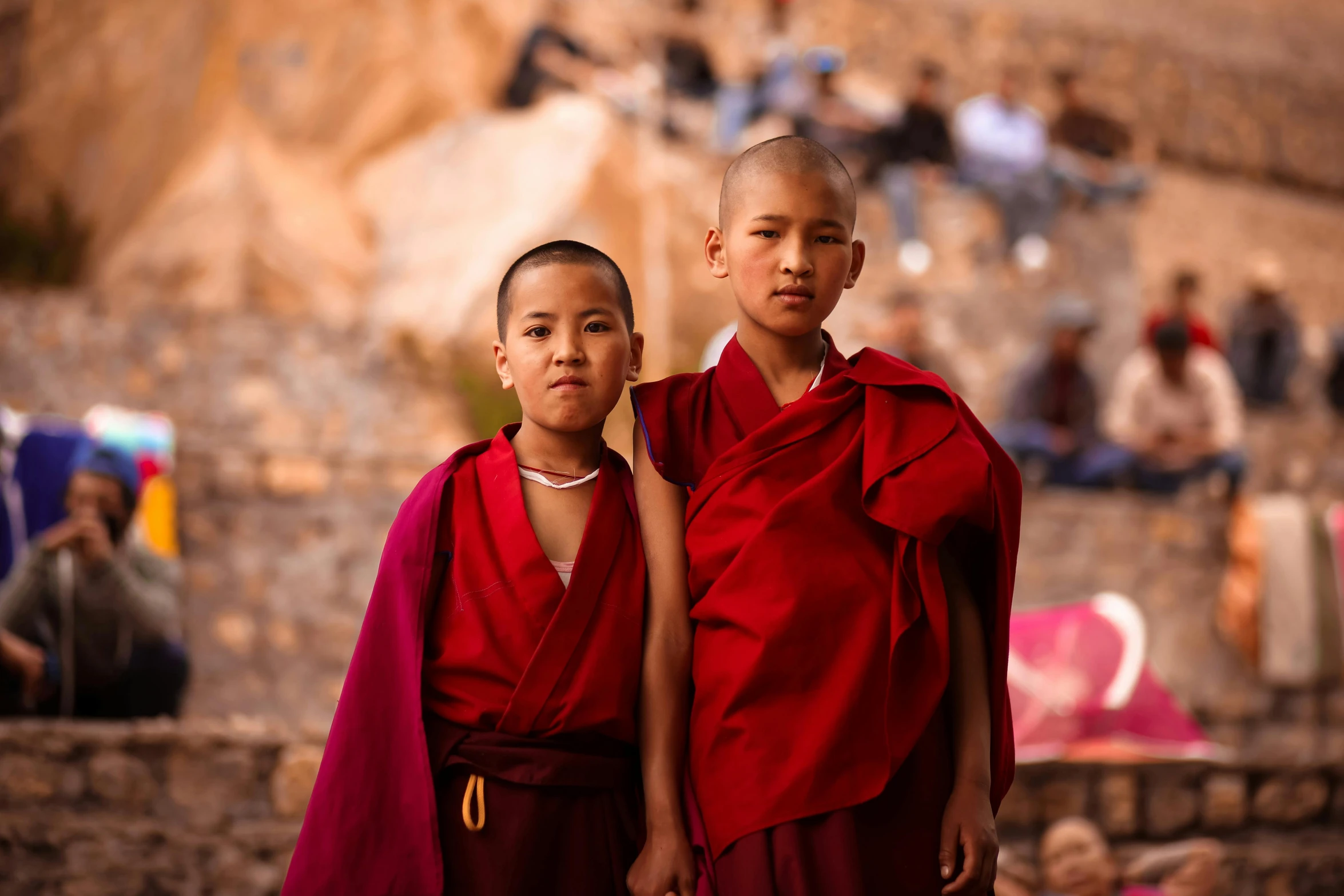 the boy and girl dressed in red are walking together