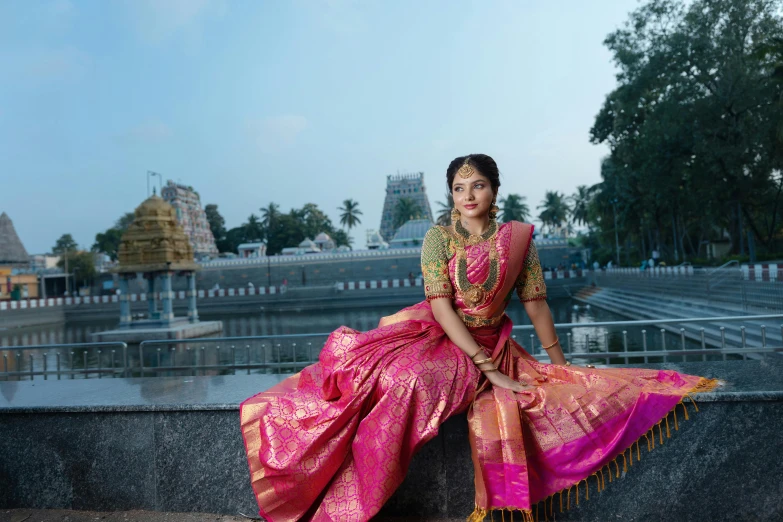 woman posing with the backdrop of water surrounding her