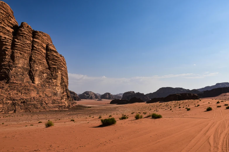 a landscape image in the desert with large rocks and scrubbery