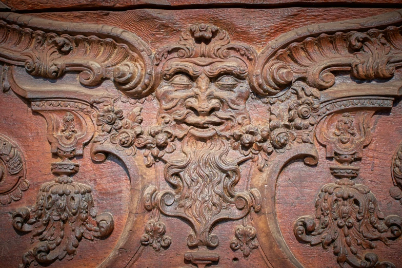 decorative carving on the back of an old wooden door