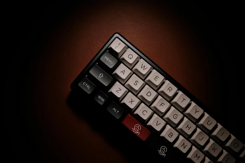 the black and red color combination keyboard with it's case on top