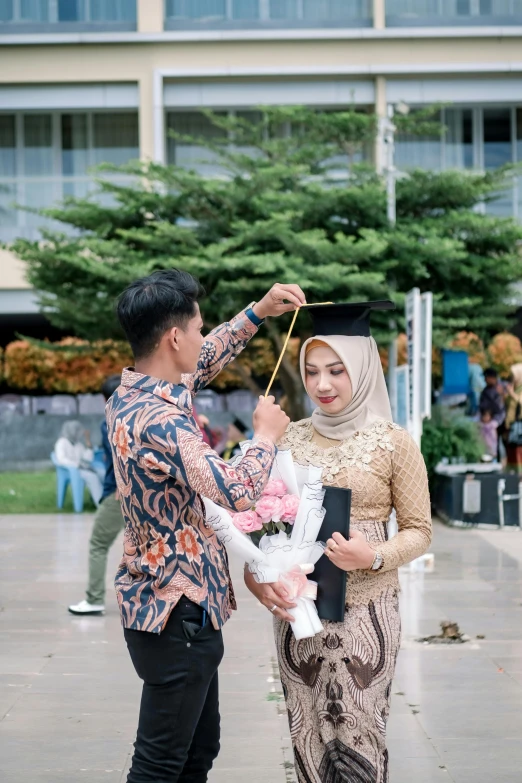 a man and a woman standing next to each other