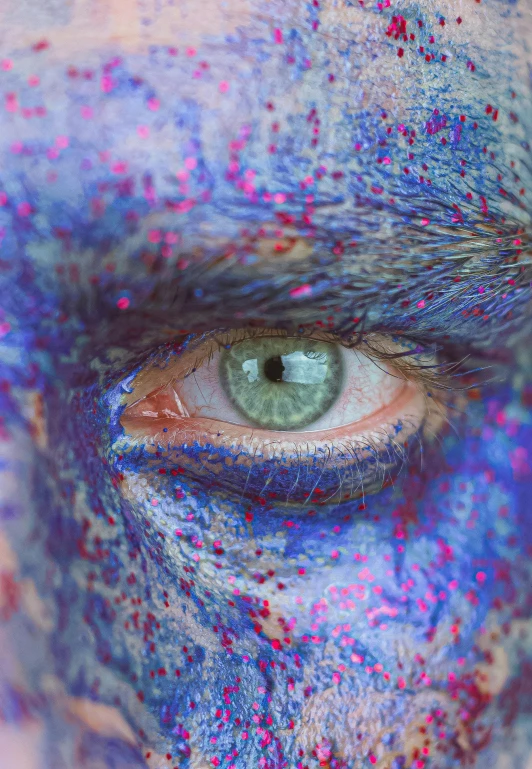 an artistic po with blue and pink shapes in the eyes