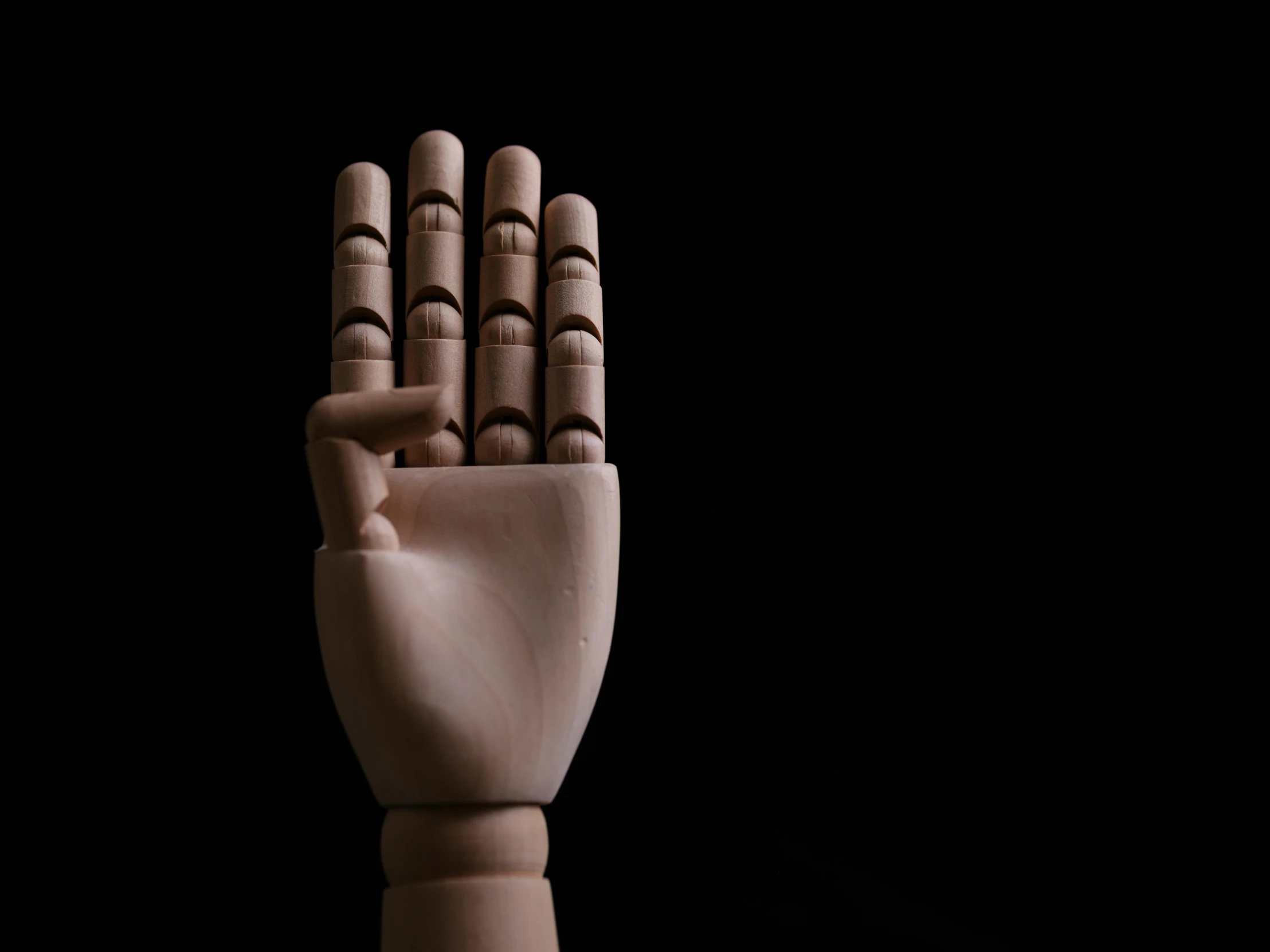a hand is folded to show the thumb