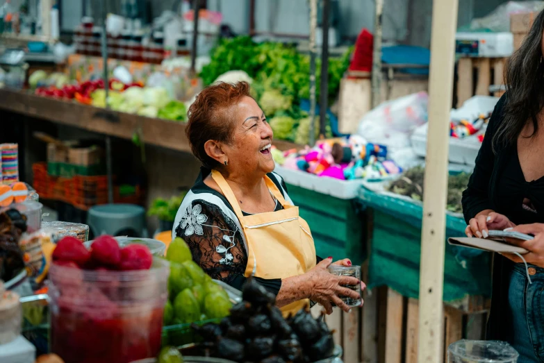 two women talking in a grocery store