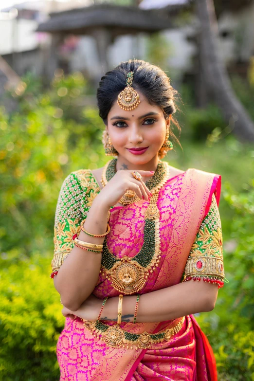 indian woman in a pink sari smiling