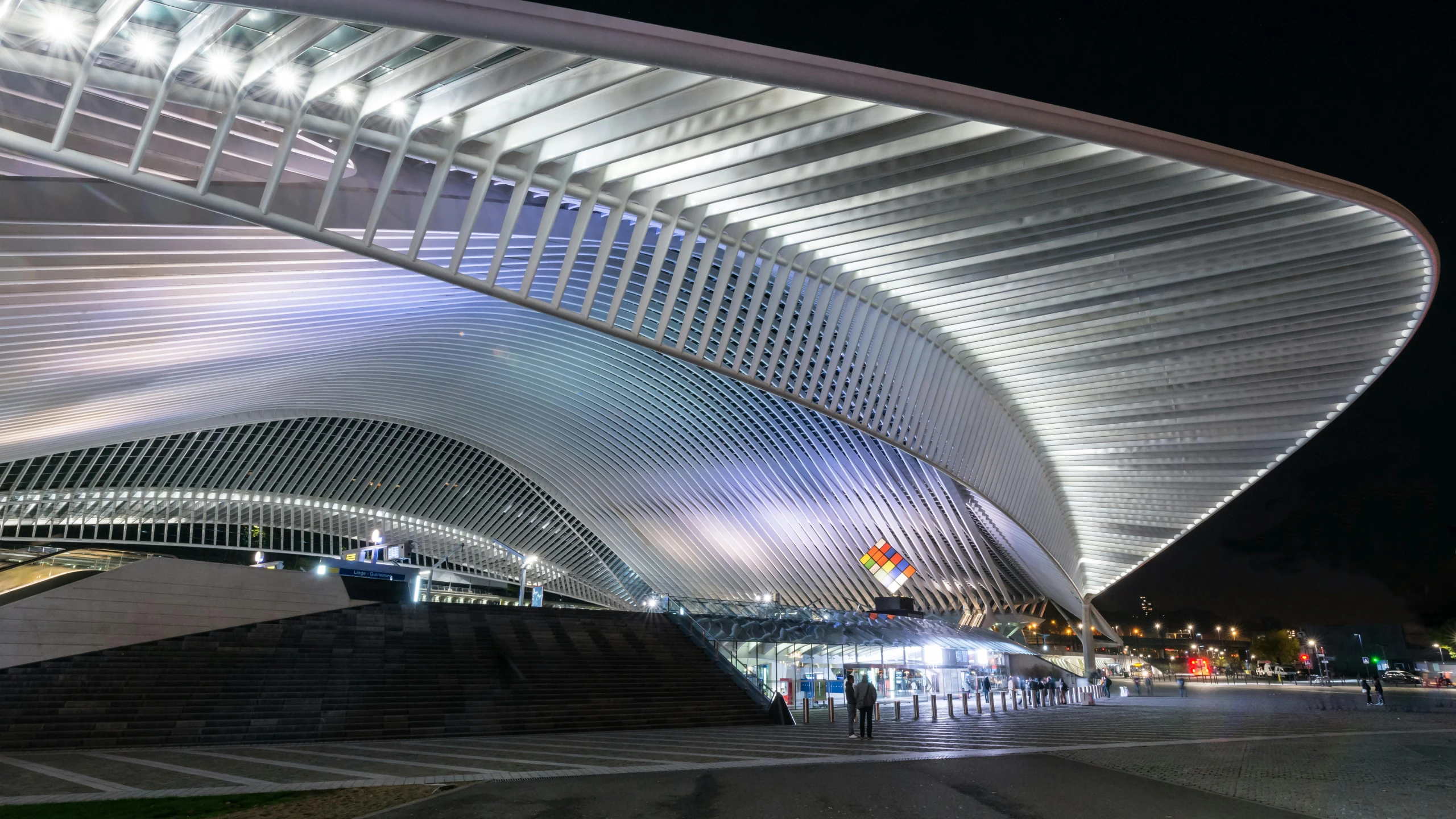 the front of an artistic looking building at night