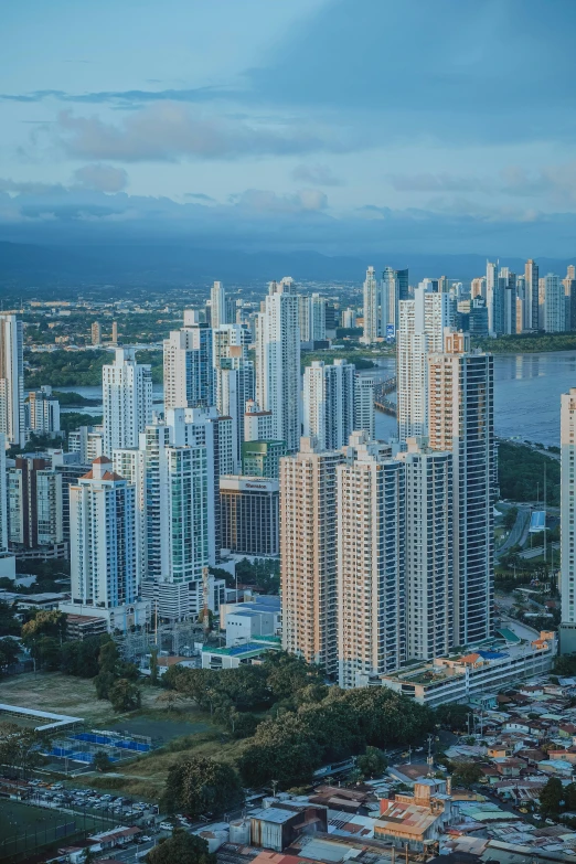 an aerial view of the city with tall buildings