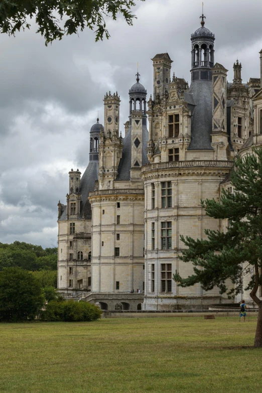 the large palace has a clock tower at the top