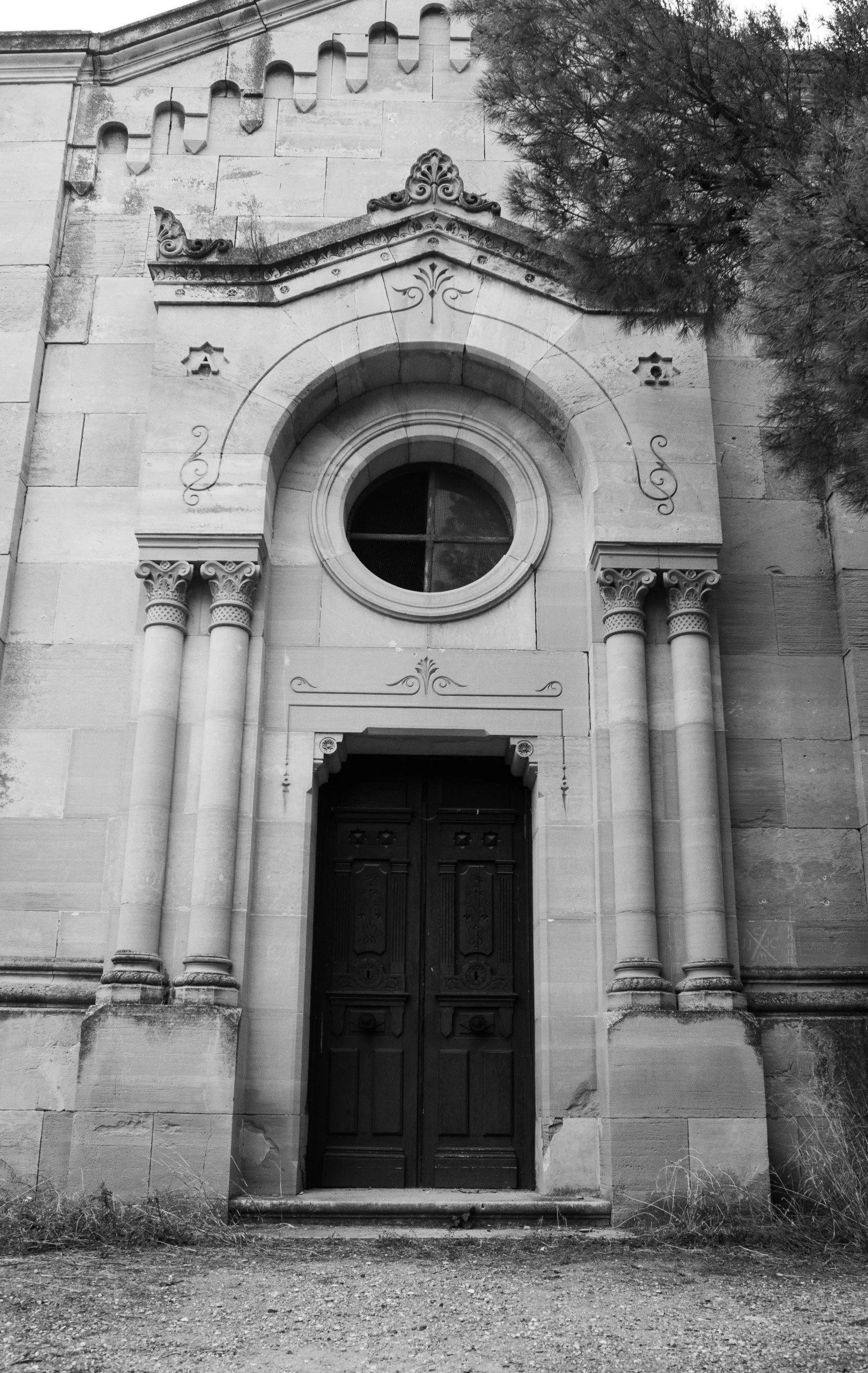 an old church has a doorway with a window