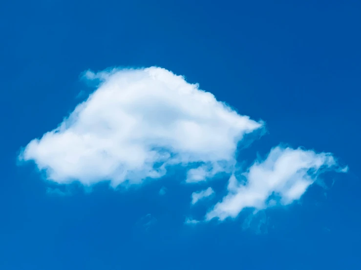 a plane flying on a bright blue sky