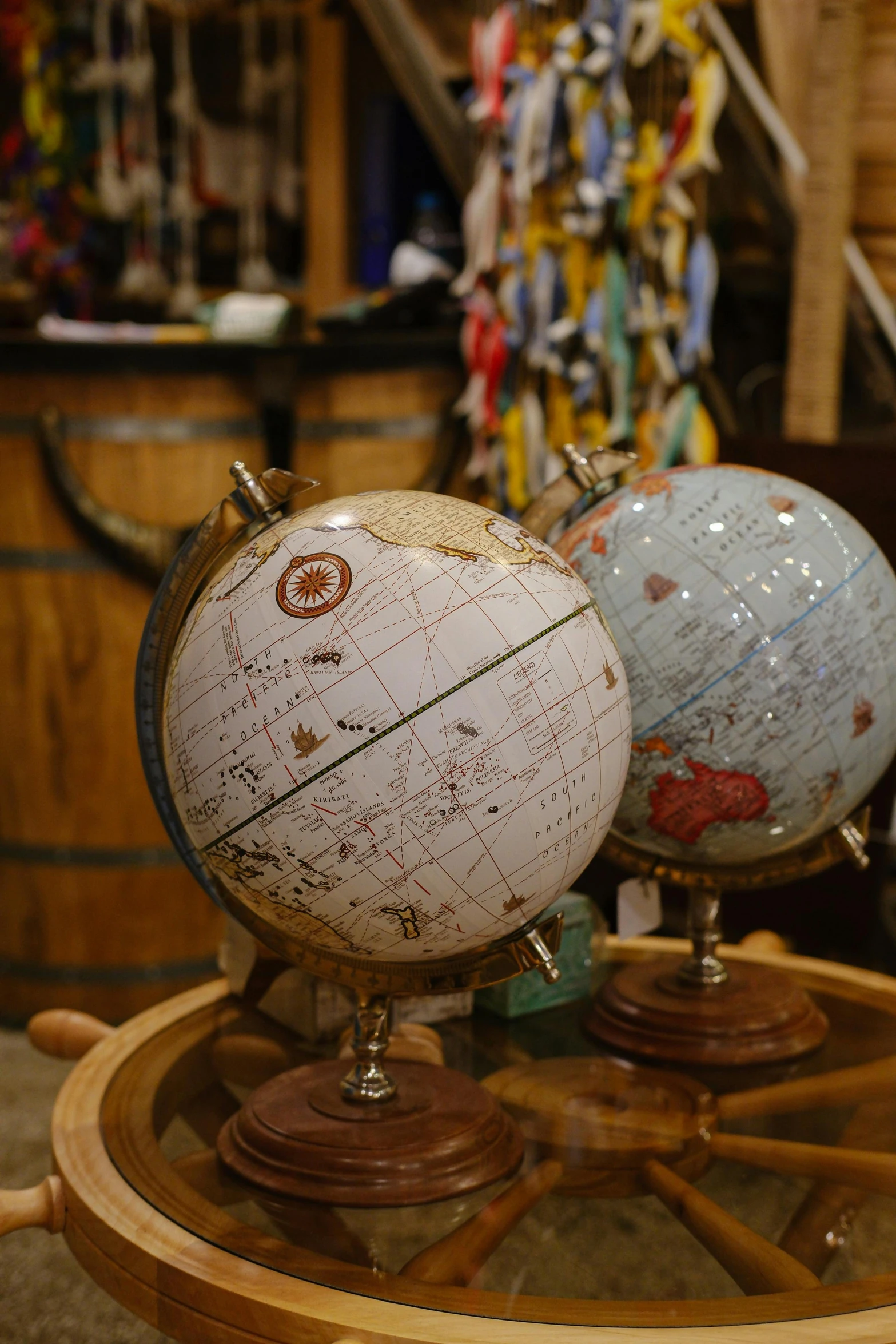 a small desk with three different sized globes