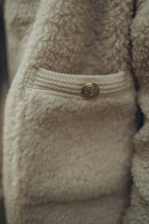 a close up of a coat with a on