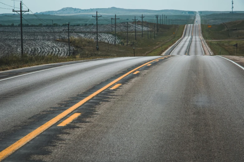 empty highway with no cars driving down the middle