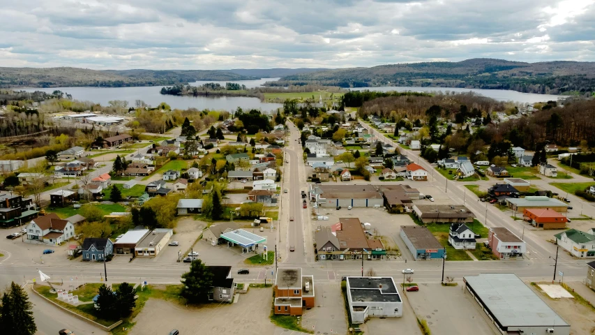 a wide open area with cars parked along the sides