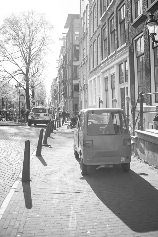 the car is parked on the city side walk