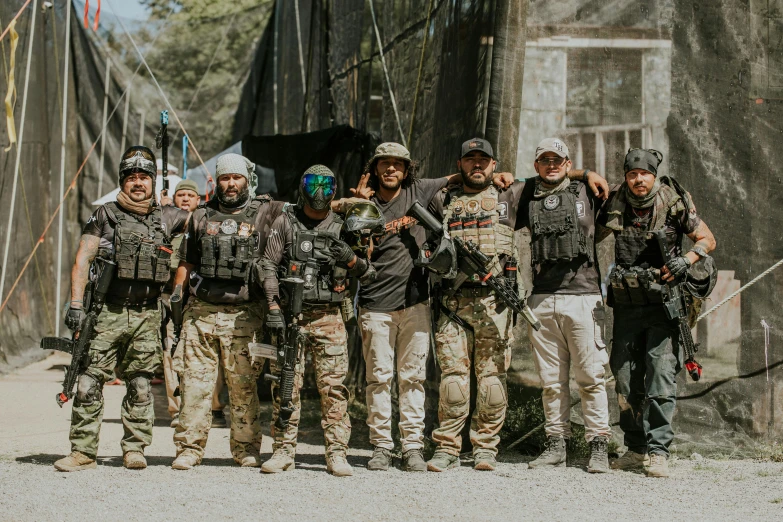 a group of soldiers is posing in front of a building