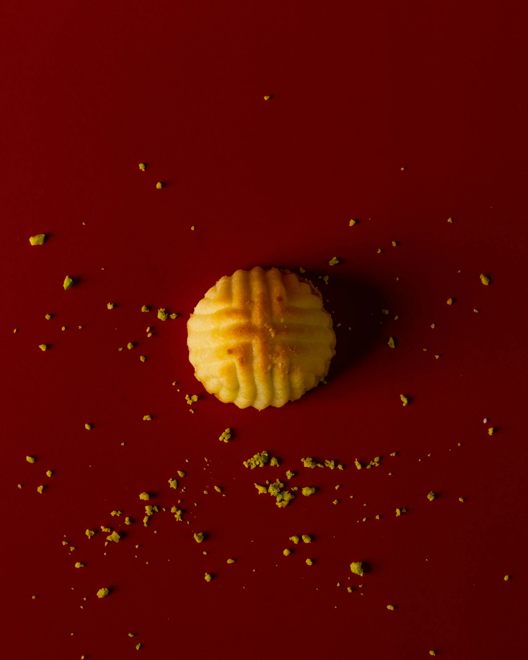 a macaroni and cheese pastry on a red table