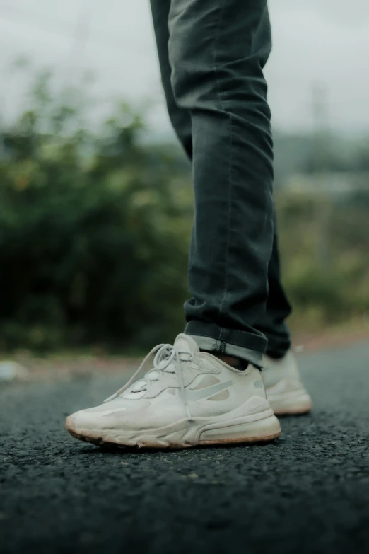 the back of a person's foot standing on the ground