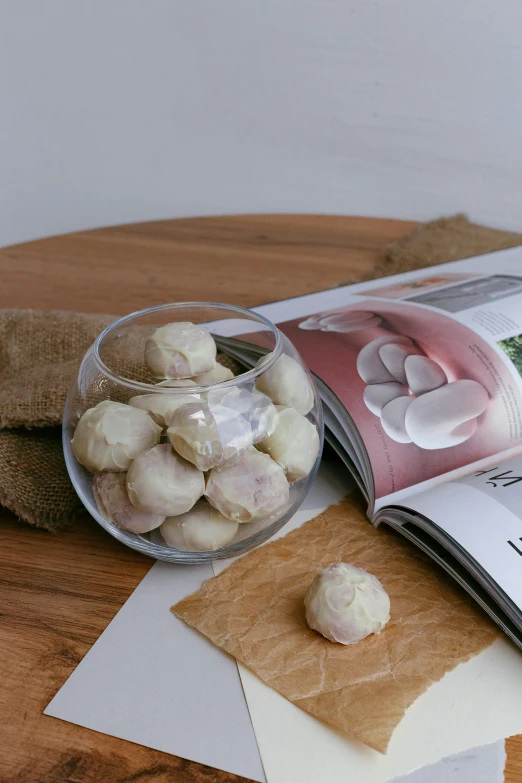 a jar of garlic sitting on top of a table