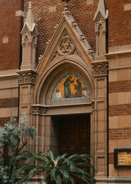 an ornate building with a palm tree outside