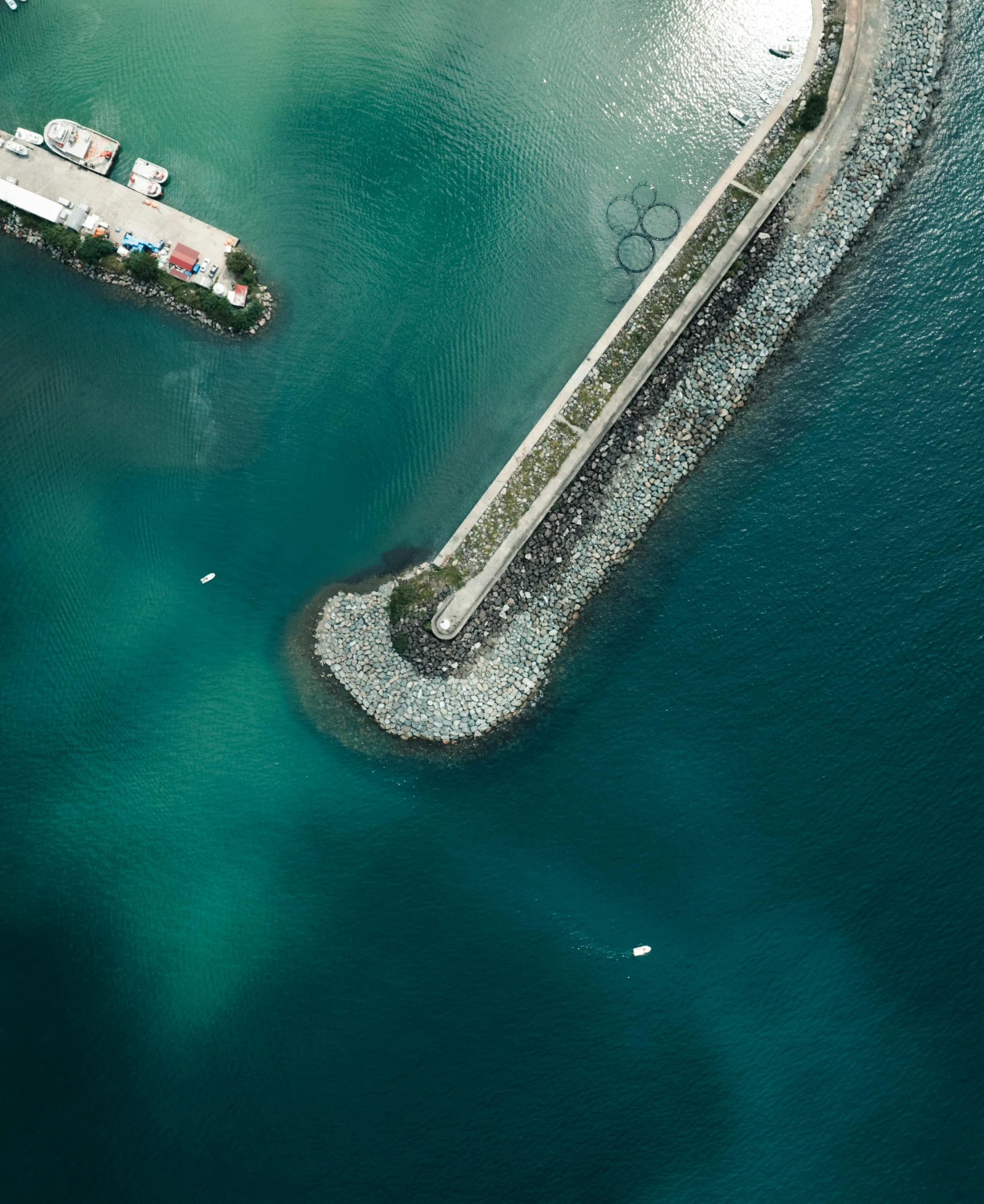 an aerial view of an airplane wing flying above the water