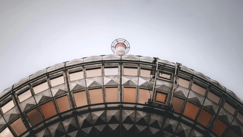 a person standing at the top of a metal structure