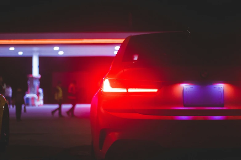 the rear end of a car with its lights on