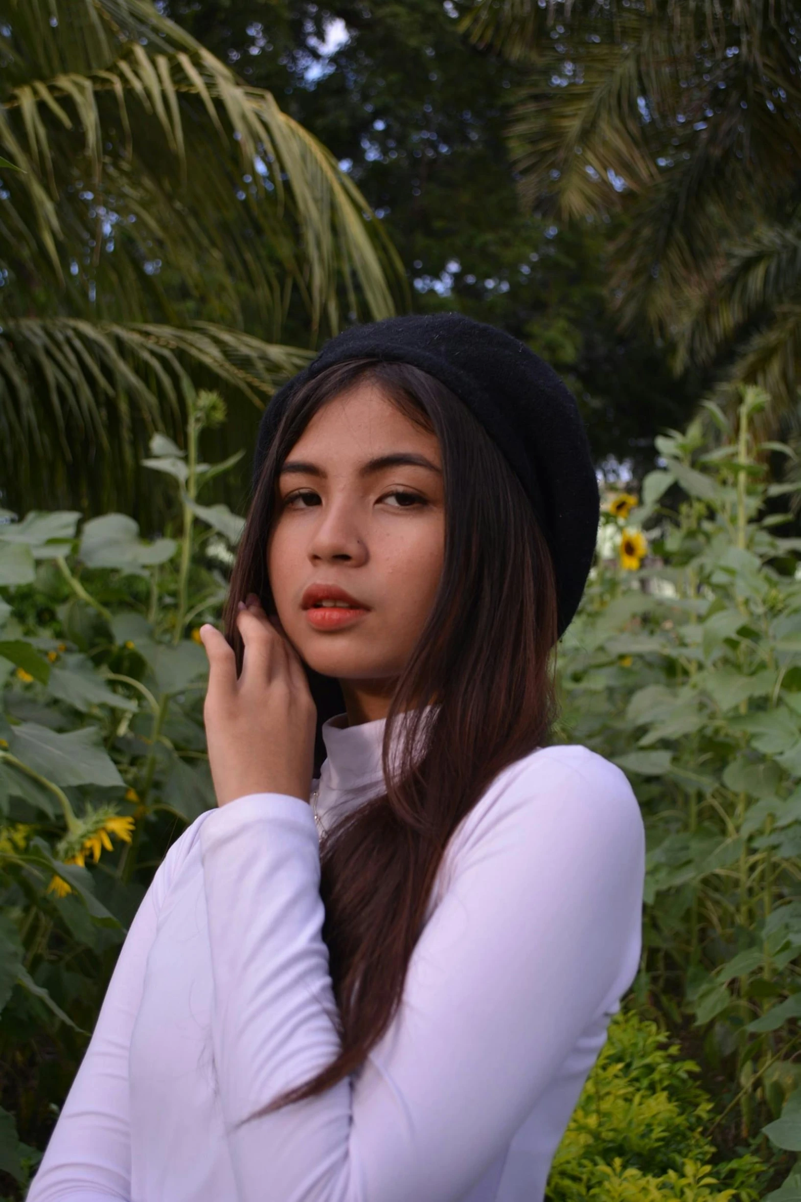 a young woman holding a cell phone to her ear