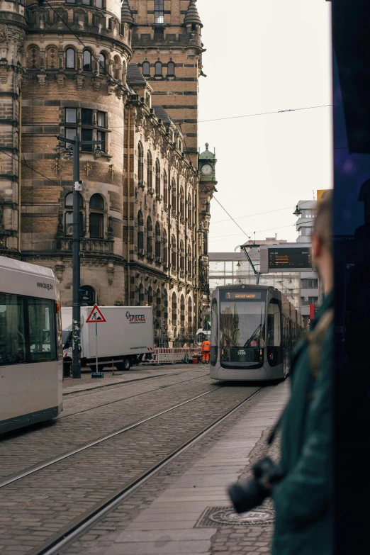 a train coming down the tracks in a city