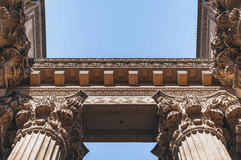 the top of two columns that have windows on them