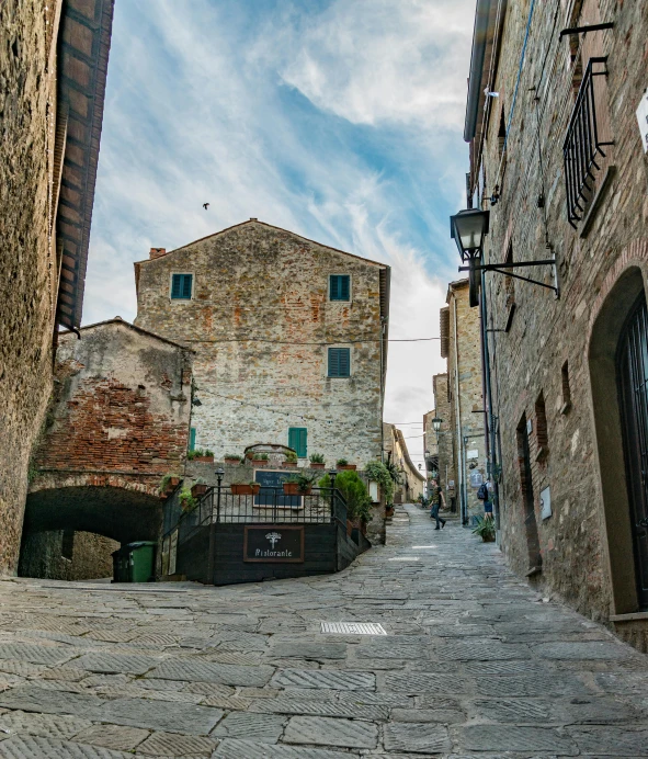 looking up an alley way near some buildings