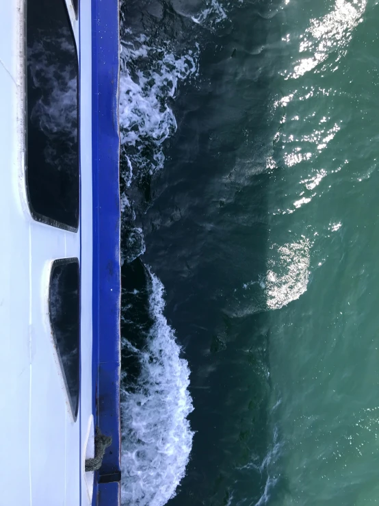view from above of the bow of a boat near the shore