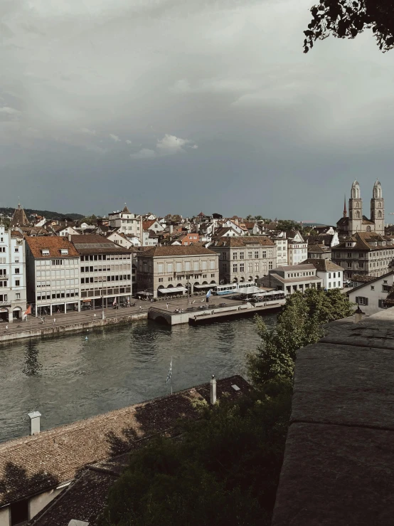 the city skyline is shown along a body of water