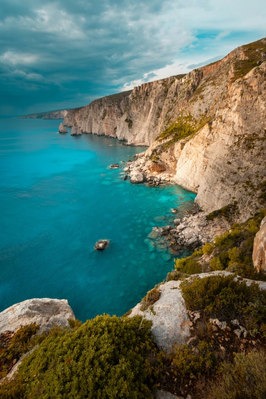 a view of an ocean bay from a cliff