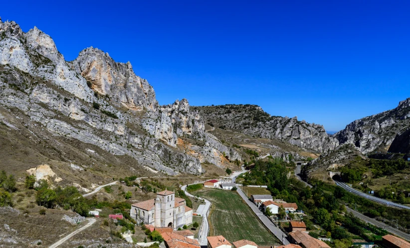 an aerial view of the countryside with many buildings