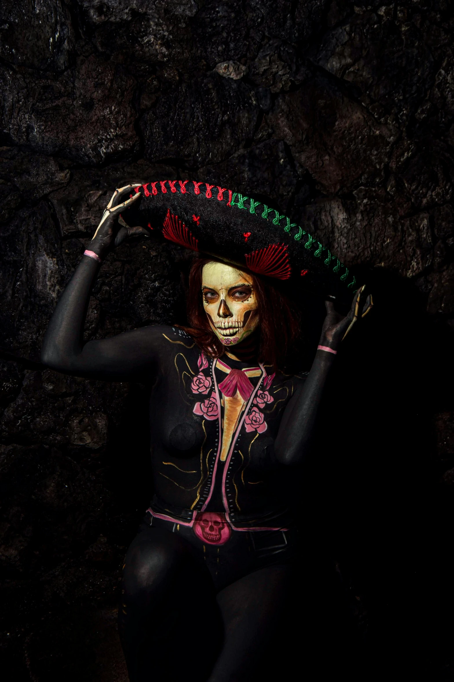 a woman in skeleton makeup posing for a po