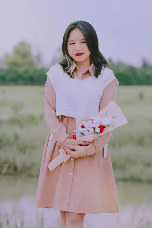 a female with long hair wearing a white and pink dress