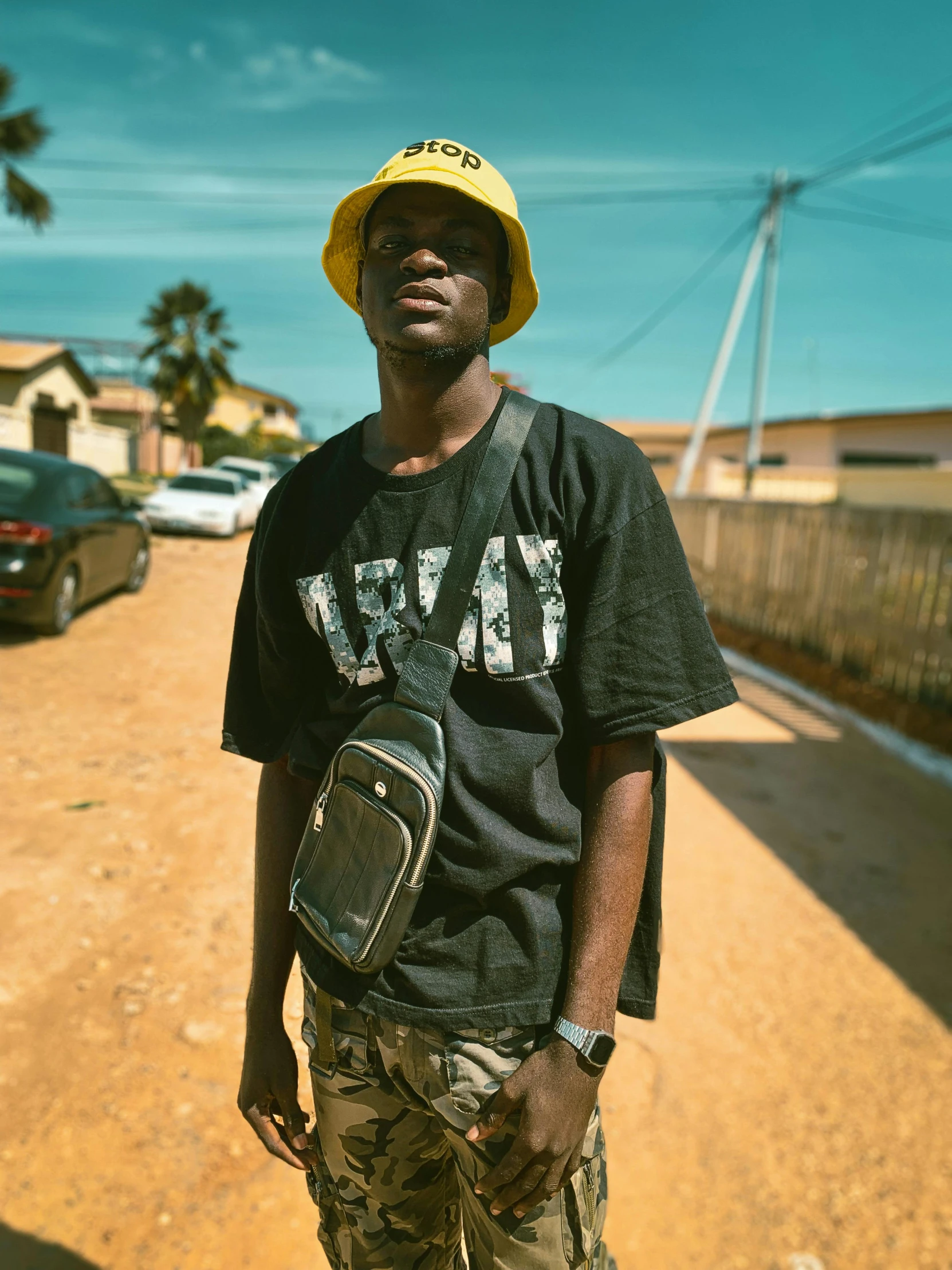 man on a dirt road with a backpack